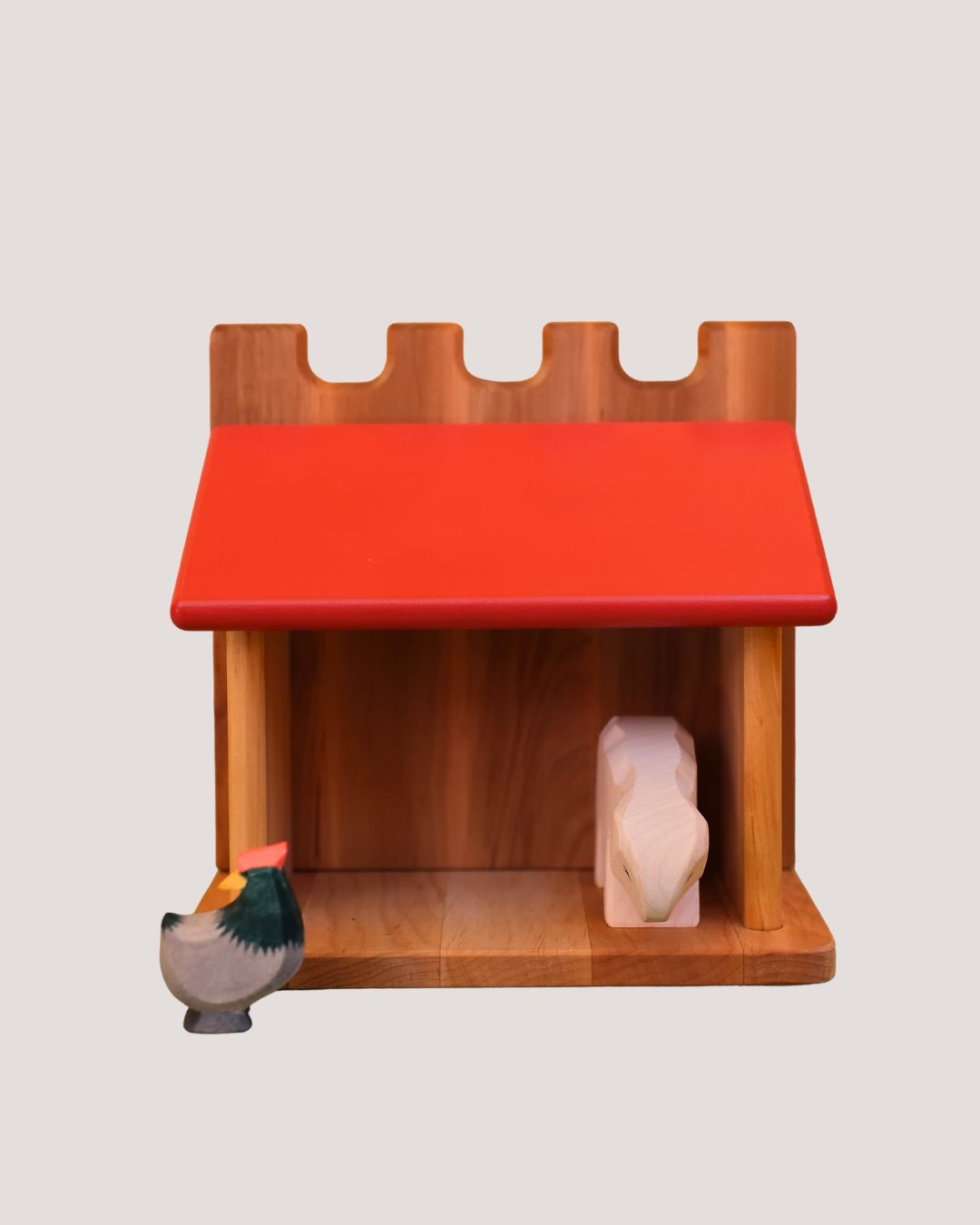 Liten stall med rødt tak