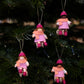 Julebarn på kjelke - jente rosa kjole - hengeullfigur