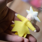Liten stjerne med bjelle inni - hengeullfigur