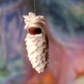 Liten snøkongle - hengeullfigur