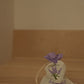 Lavendelblomster i linpose