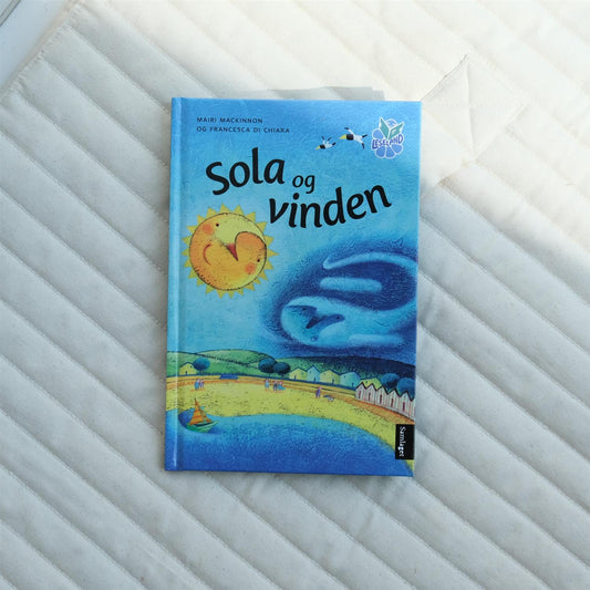 Sola og vinden: basert på ein fabel av Æsop - Mairi Mackinnon